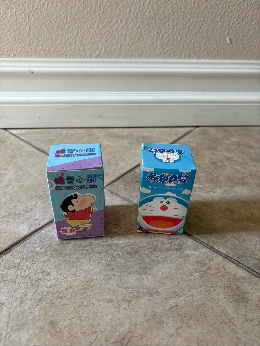 1 Crayon ShinChan and 1 Doraemon blind box